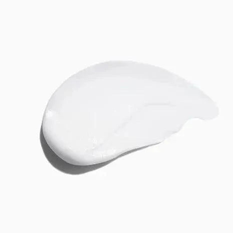 A smooth, white cream from the Symbiose Fondant Apaisant Essentiel hair conditioner by Kerastase.