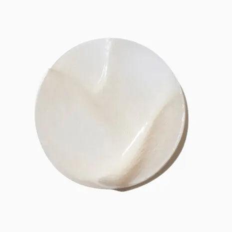 Creamy texture of Kerastase Symbiose Masque Revitalisant Essentiel hair mask suitable for all hair types.