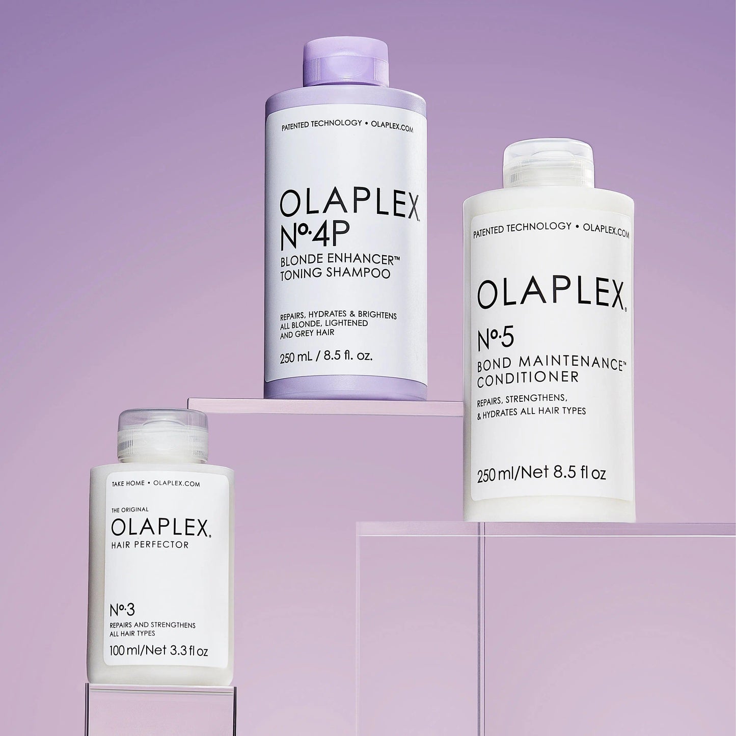 OLAPLEX Blonde Maintenance System: Nº.3 Hair Perfector, Nº.4P Shampoo, and Nº.5 Conditioner for vibrant hair.
