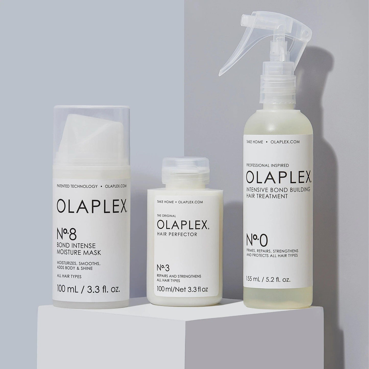 Olaplex Bond Treatment System featuring Nº.0, Nº.3, and Nº.8 for intensive hair repair and moisture.