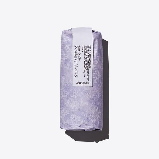 Davines Blow Dry Primer packaging in lavender, showcasing anti-humidity and heat protectant benefits for hair.