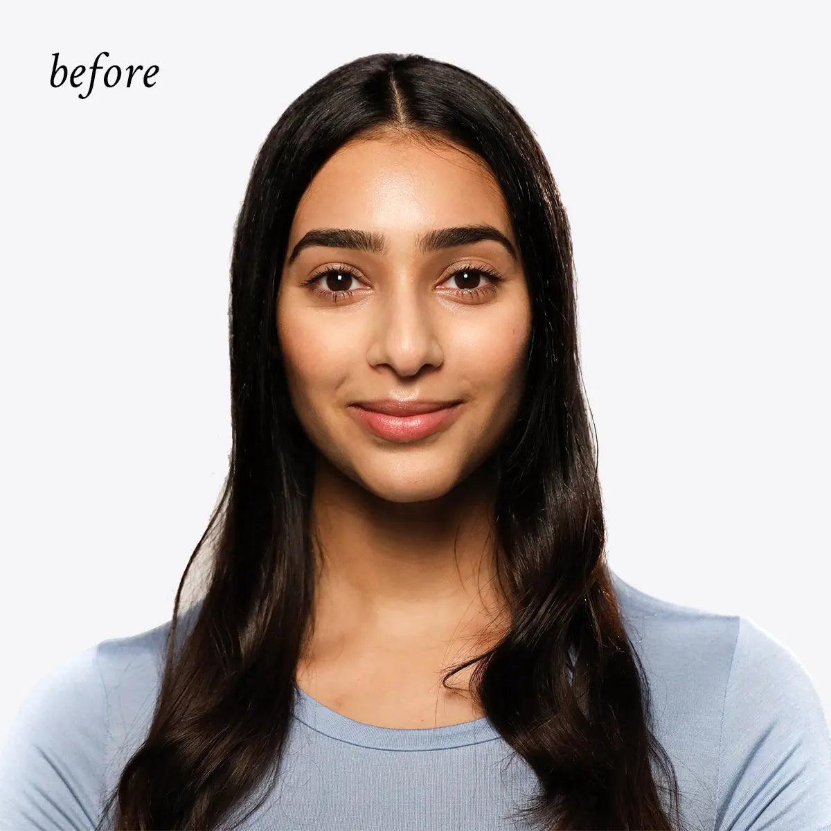 Before photo of a woman with long, dark hair showcasing natural beauty and smooth skin.