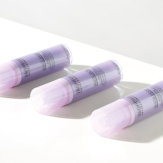 Three bottles of White Moon Brightening Concentrate, showcasing sleek design and advanced skincare technology.