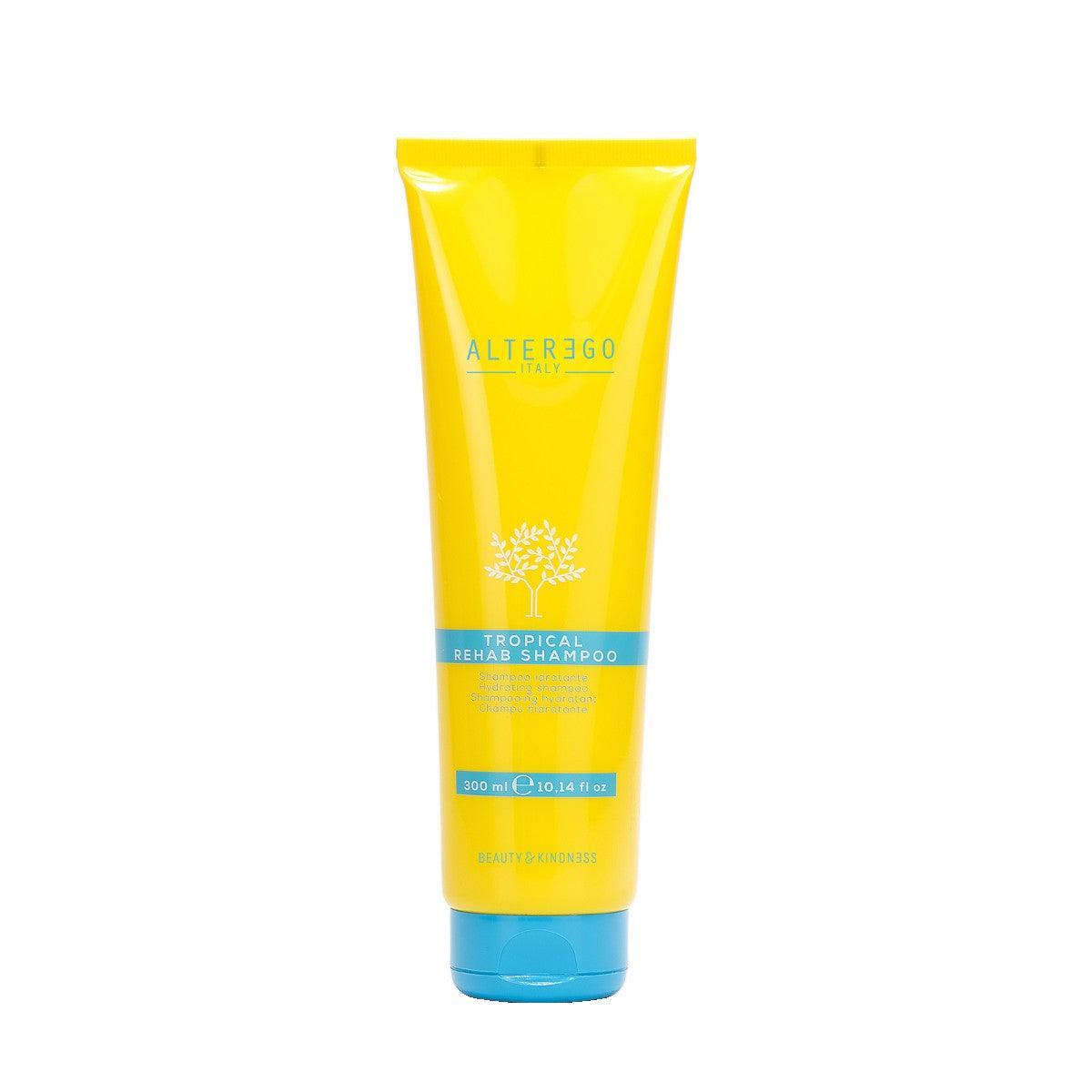 Tropical Rehab Shampoo in a bright yellow tube, designed to cleanse and hydrate hair after sun exposure.