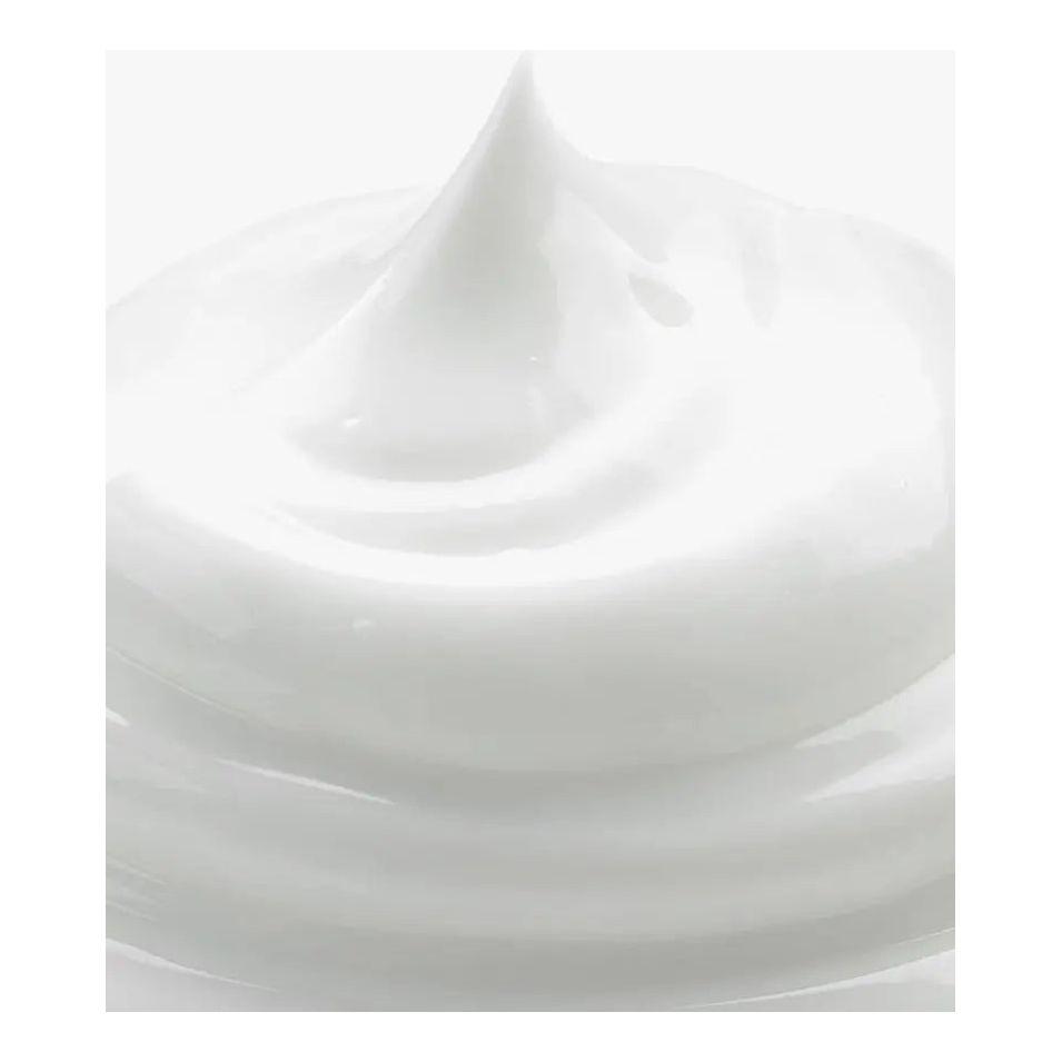 close-up of ultra-rich moisturizer cream with a smooth, whipped texture, showcasing its nourishing properties.