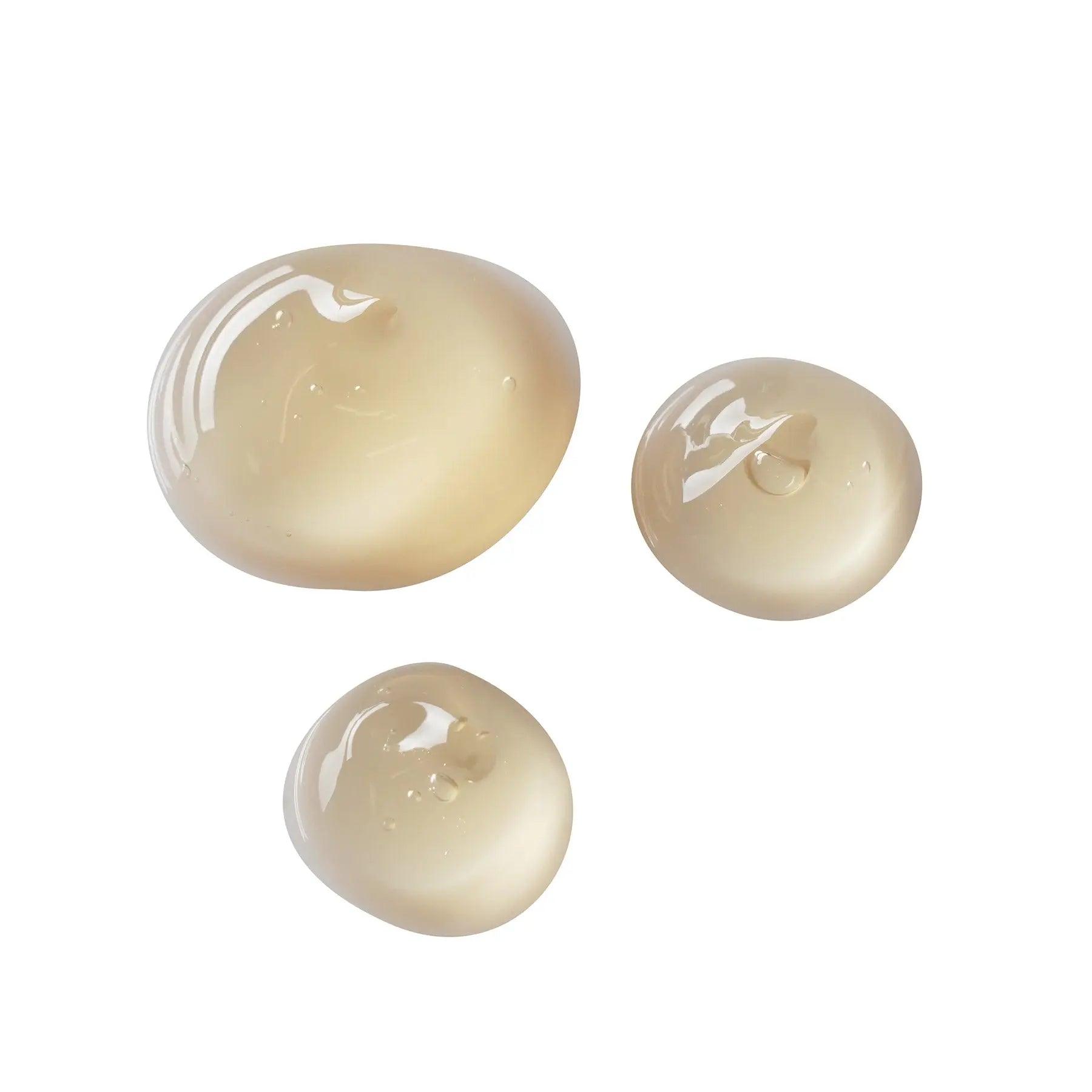 Under eye gel drops showcasing a smooth, transparent texture, ideal for reducing puffiness and dark circles.