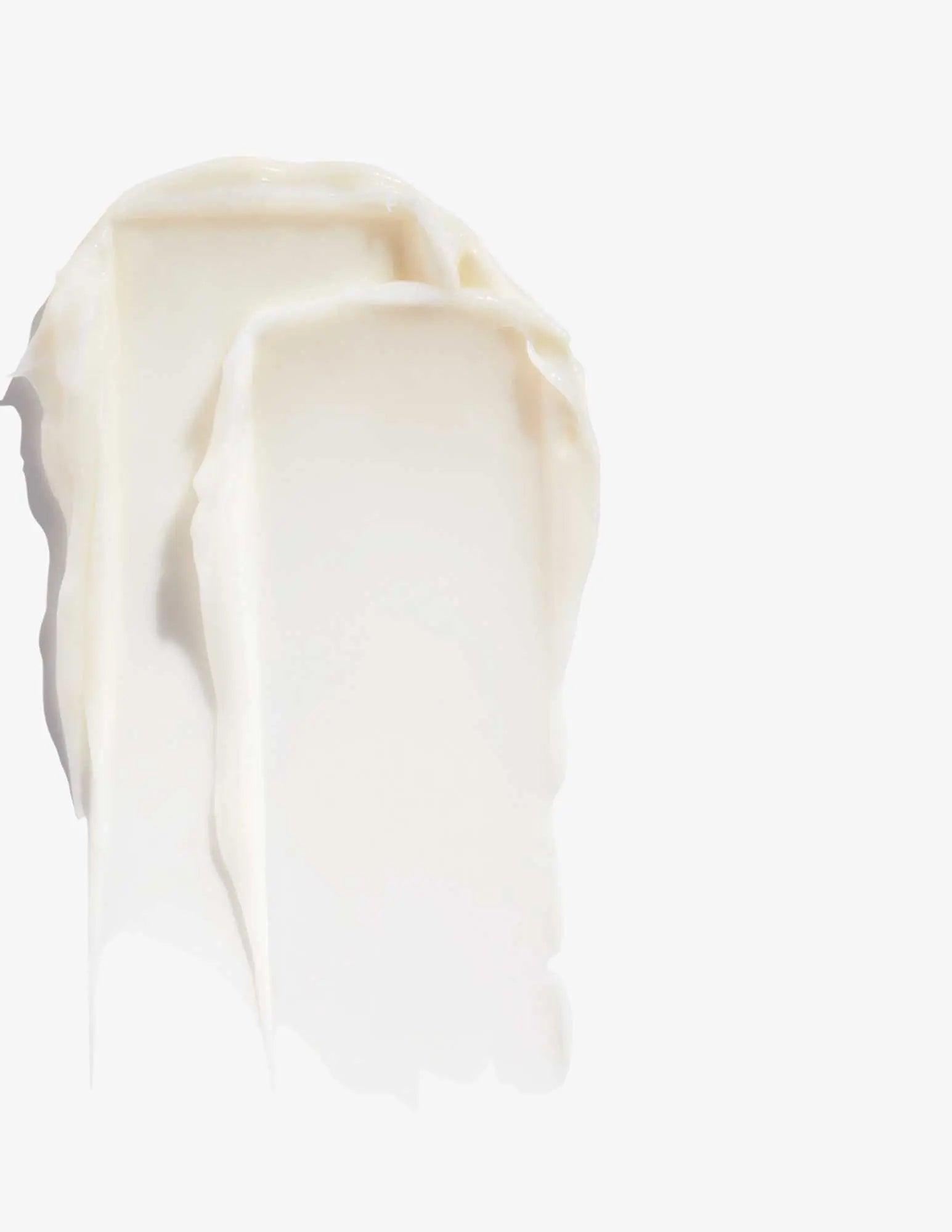 Creamy texture of Redken Volume Injection Conditioner showcasing its lightweight formula for fine hair.