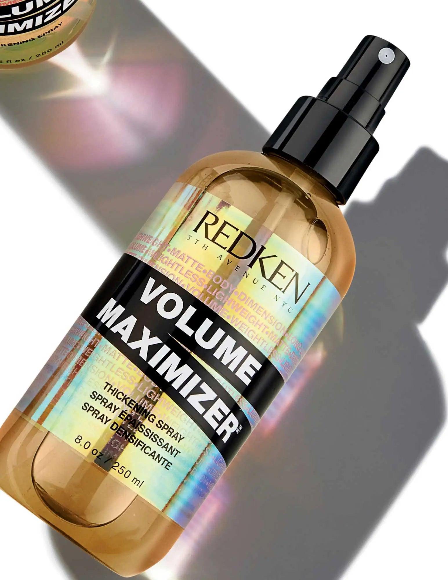 Redken Volume Maximizer volumizing spray in a sleek bottle, designed for fuller hair and all hair types.