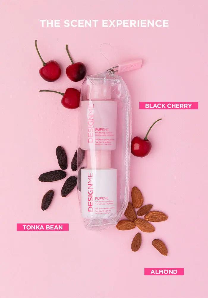 Travel-size shampoo and conditioner set with black cherry, tonka bean, and almond, on a pink background.