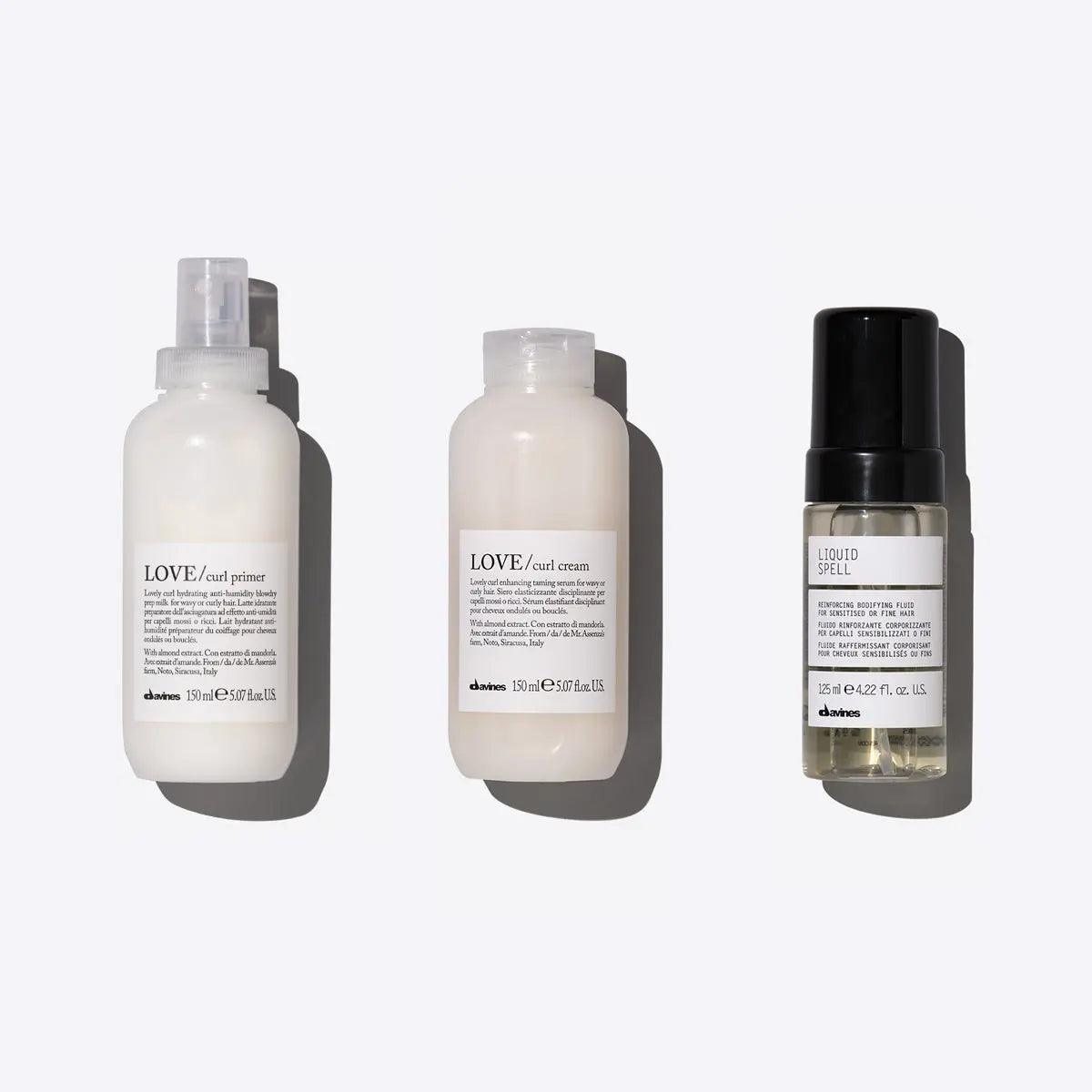 Styling set for voluminous coils featuring LOVE CURL Primer, LOVE CURL Cream, and Liquid Spell leave-in treatment.