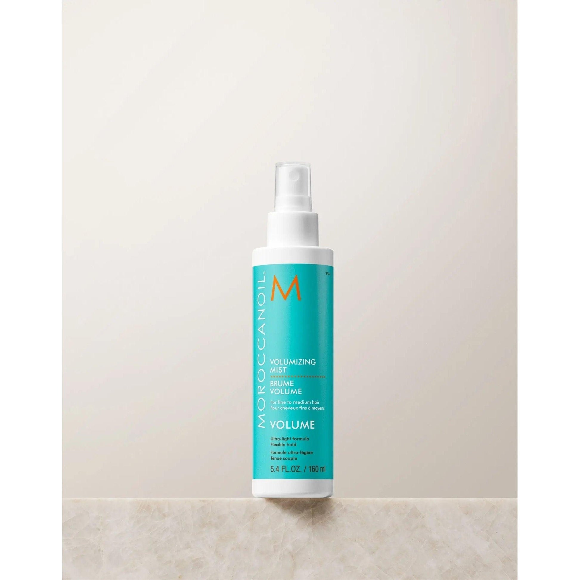 Volumizing Mist from Moroccanoil in a spray bottle for fuller, bouncy hair with argan oil and rice amino acids.