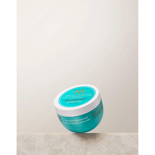 Moroccanoil Weightless Hydrating Mask in a teal jar for moisturizing and reviving fine, dry hair.