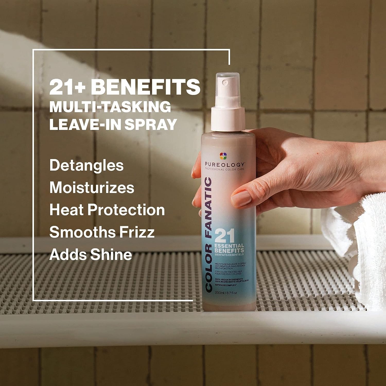 Pureology Colour Fanatic Leave-in Treatment Spray showcasing 21 benefits for color-treated hair in a stylish setting.