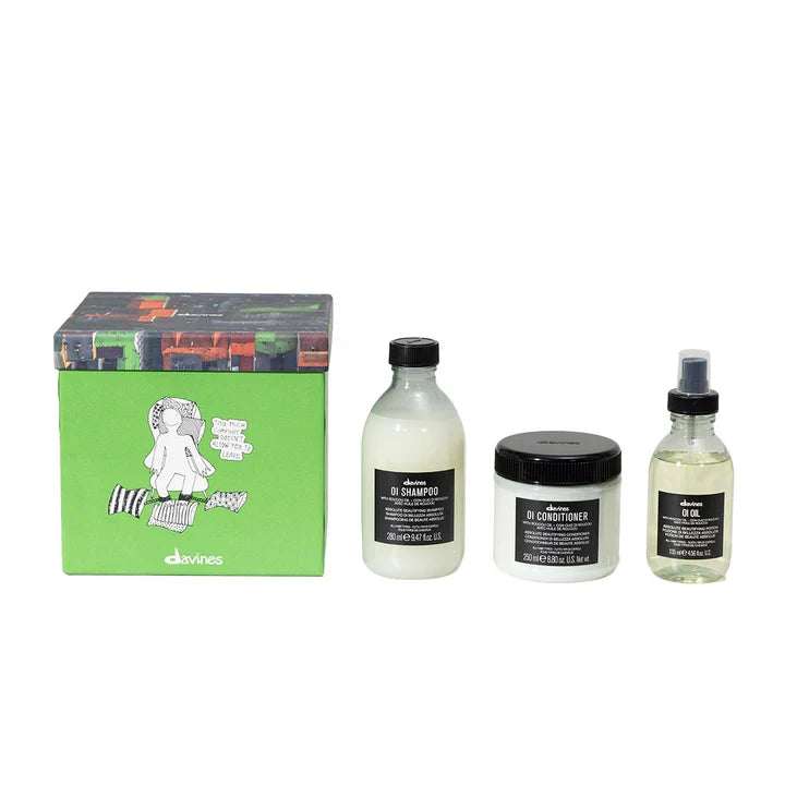 Davines OI Traditional Gift Set with OI Shampoo, Conditioner, and Oil for soft, shiny hair in vibrant packaging.
