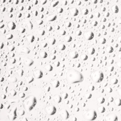 Transparent droplets of water on a smooth surface, reflecting light and creating a fresh, clean ambiance.