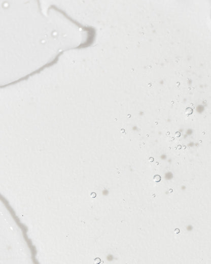 Close-up of a light serum with bubbles, illustrating the texture and clarity of Advanced Skin Lightening Serum.