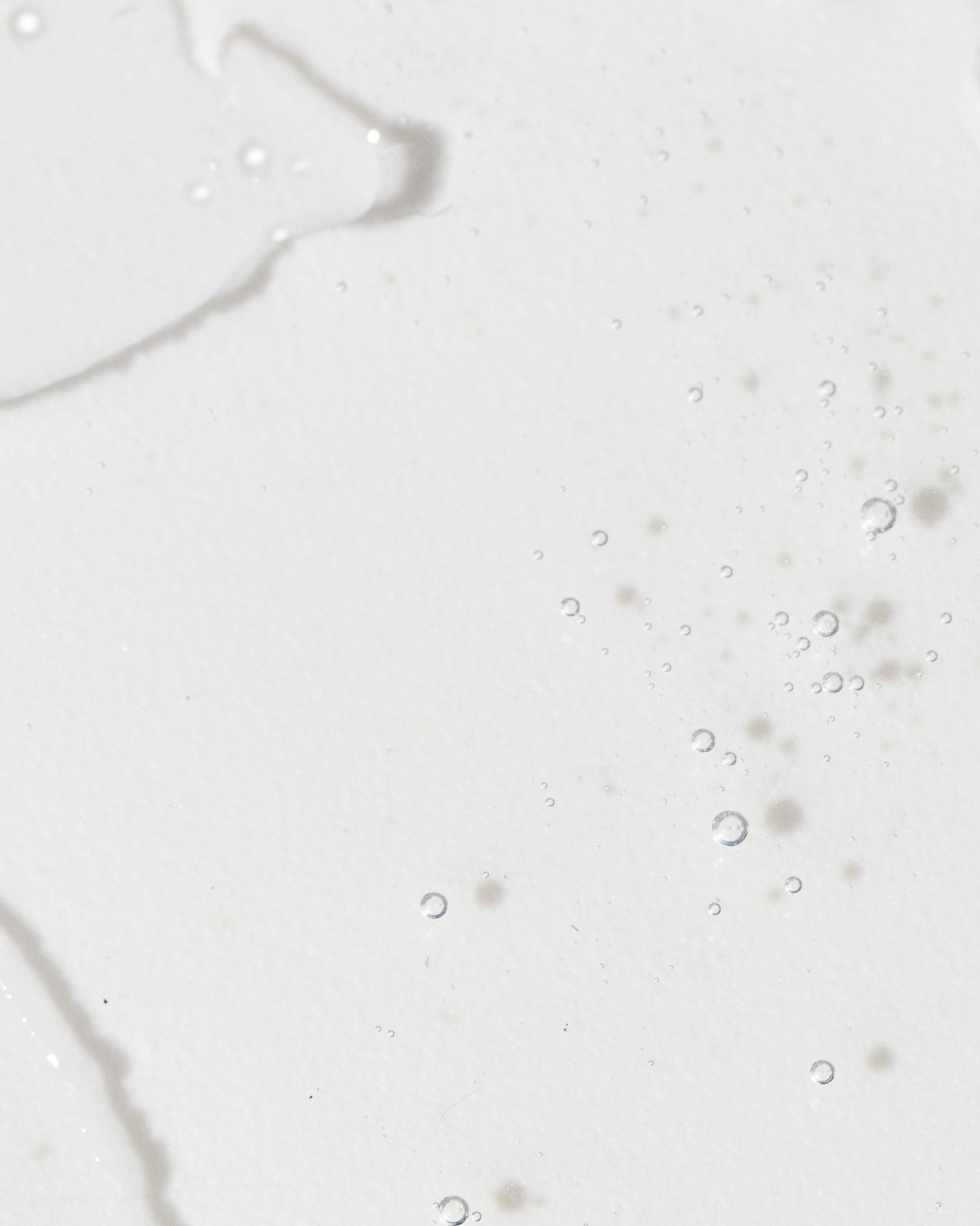 Close-up of a light serum with bubbles, illustrating the texture and clarity of Advanced Skin Lightening Serum.