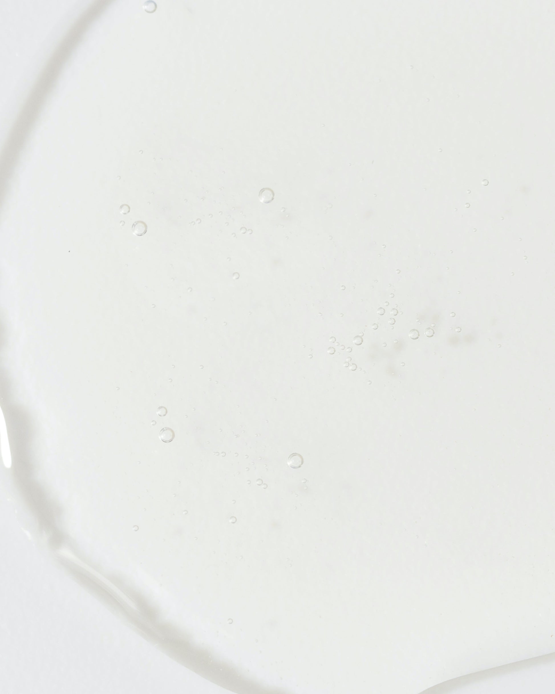 Clear gel texture of Vivier QuintiSerum™ showcasing its concentrated antioxidant formula.