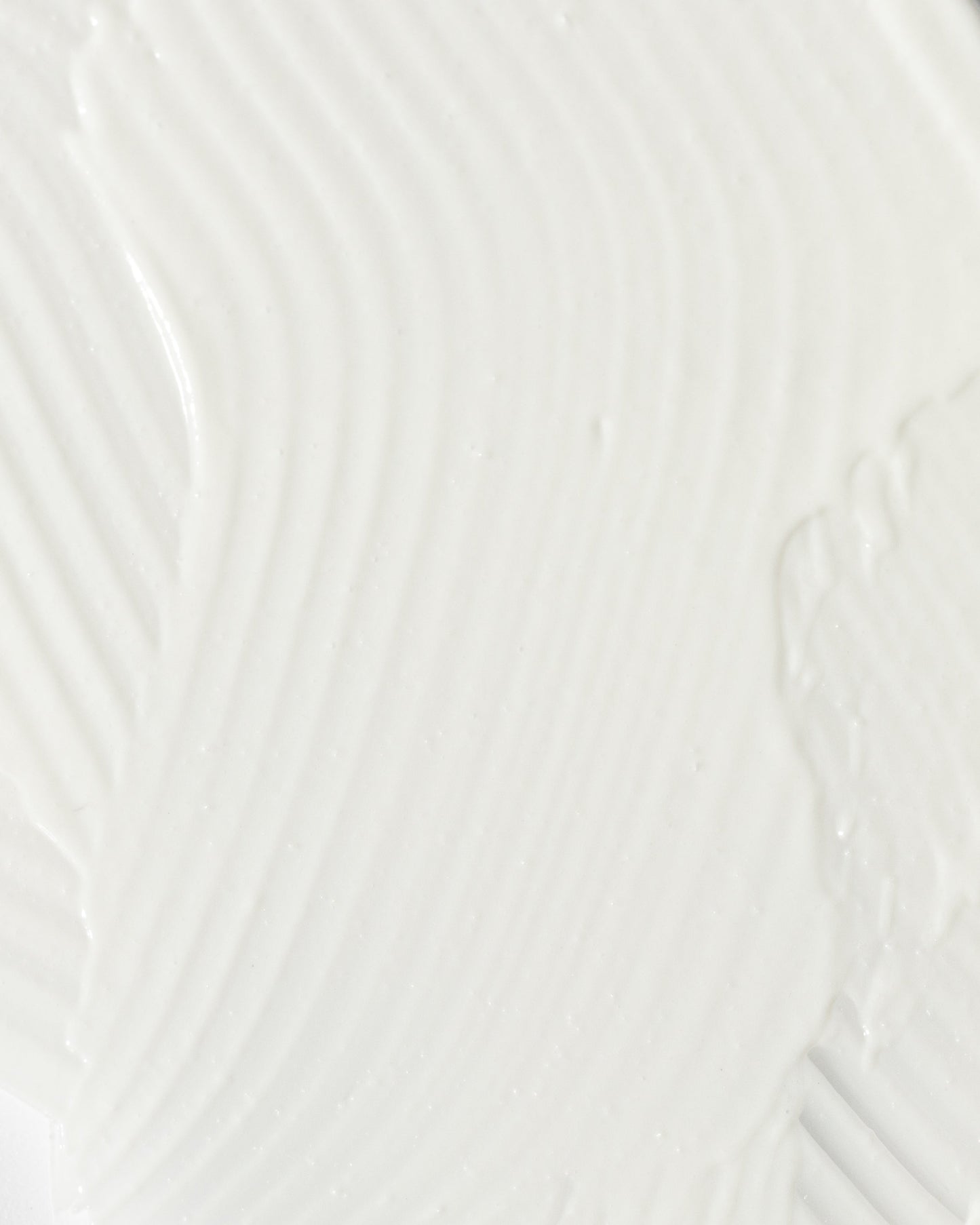 close-up of smooth, creamy texture of a soothing skincare product for calming redness and irritation