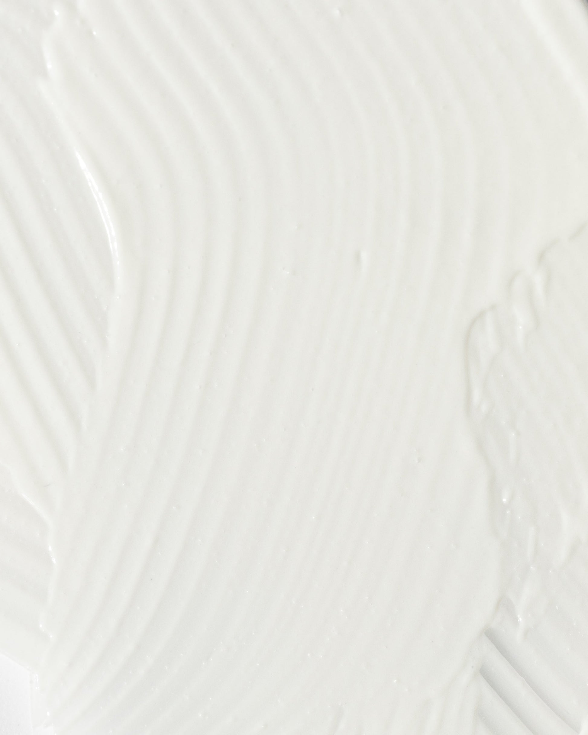 close-up of smooth, creamy texture of a soothing skincare product for calming redness and irritation