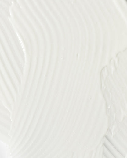 close-up of smooth, creamy texture of a soothing skincare product for calming redness and irritation