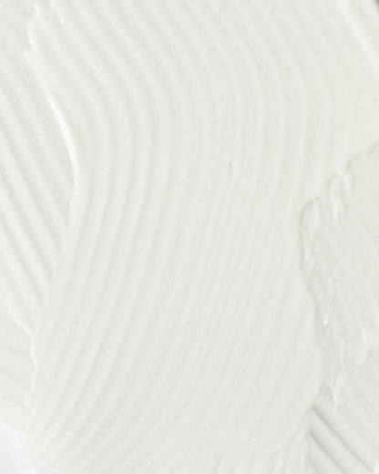close-up of smooth, creamy texture of a soothing skincare product for calming redness and irritation