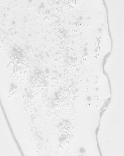 Close-up of refreshing toner texture with bubbles, showcasing its gentle, hydrating properties for skin care.
