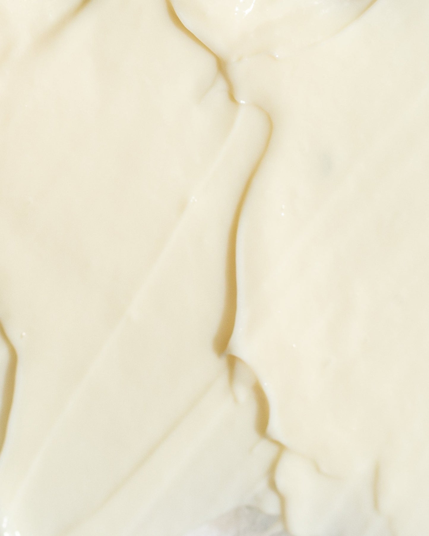 Close-up of creamy retinol 0.5% texture, showcasing a smooth, hydrating skincare formulation for anti-aging benefits.