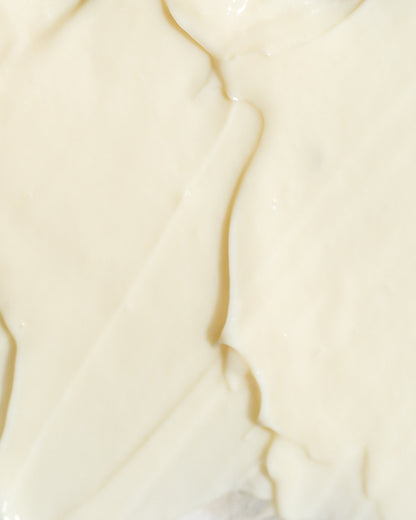 Close-up of creamy retinol 0.5% texture, showcasing a smooth, hydrating skincare formulation for anti-aging benefits.