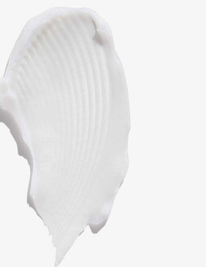 Smooth, creamy texture of Redken All Soft Shampoo swatch on a white background.