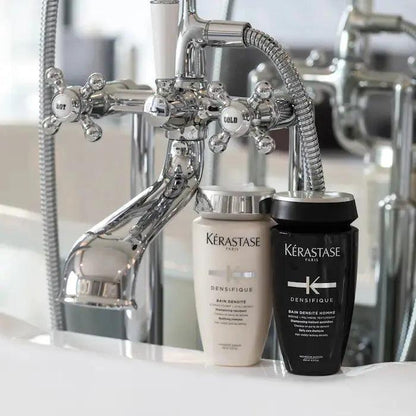Kérastase Bain Homme Densité shampoo bottles on a bathroom countertop promoting hair density and thickness for men.