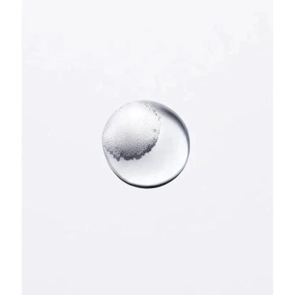 Single clear liquid bubble on a white background