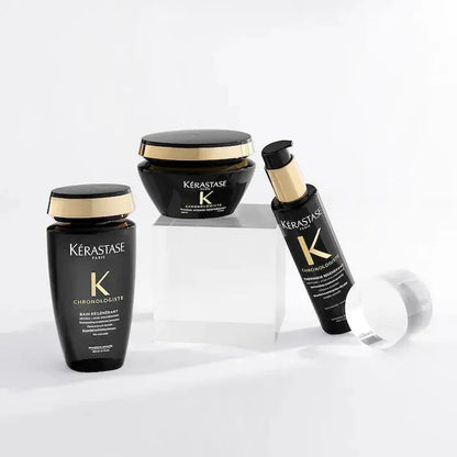 Kérastase Chronologiste hair care products, including shampoo, hair mask, and serum, on display against a white background.