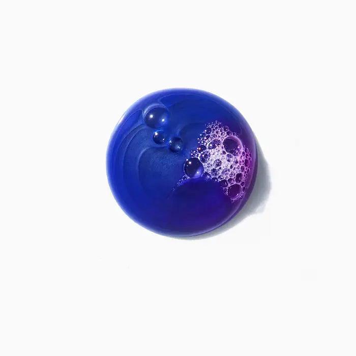 Blue and purple soap bubble on white background