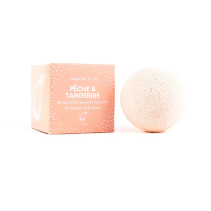 All natural bath bomb in peach and tangerine scent, with eco-friendly packaging, perfect for soothing skincare.