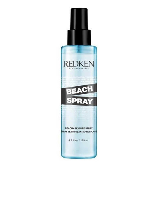 Redken Beach Spray bottle, a texturizing salt spray for effortless beachy waves and enhanced hair texture.
