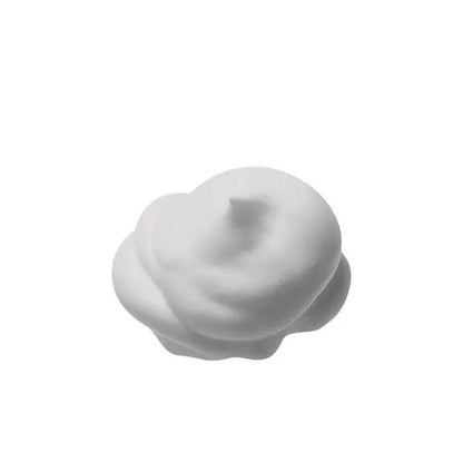White, fluffy mousse texture of Boue En Mousse Réductrice - Fuoco Plus for body sculpting and detox.