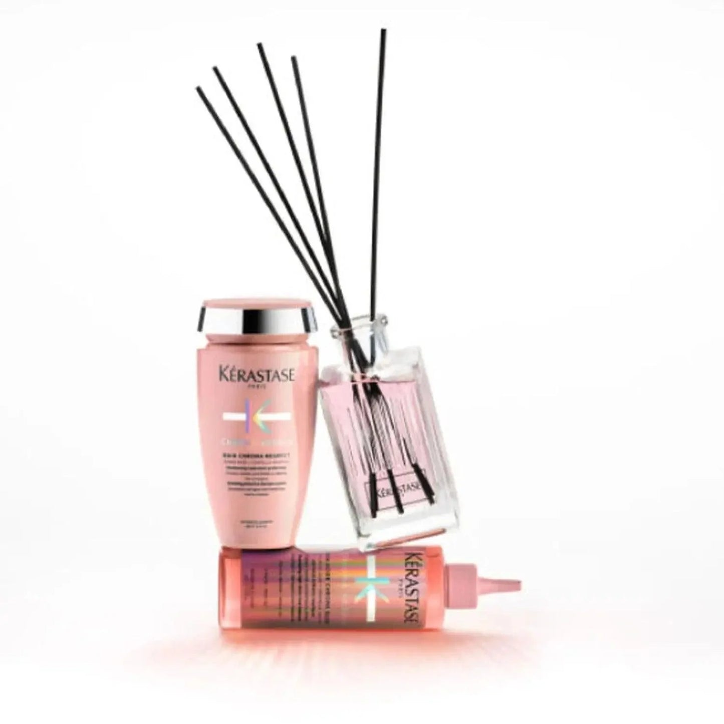CHROMA ABSOLU home fragrance collection featuring stylish diffuser, shampoo, and treatment in elegant packaging.