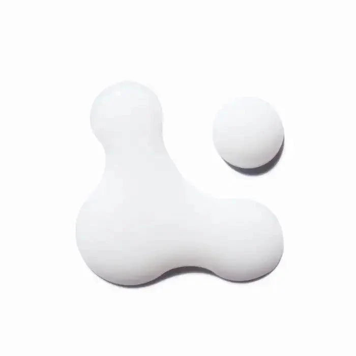 Modern white abstract sculpture with geometric shapes.