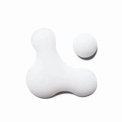 Modern white abstract sculpture with geometric shapes.