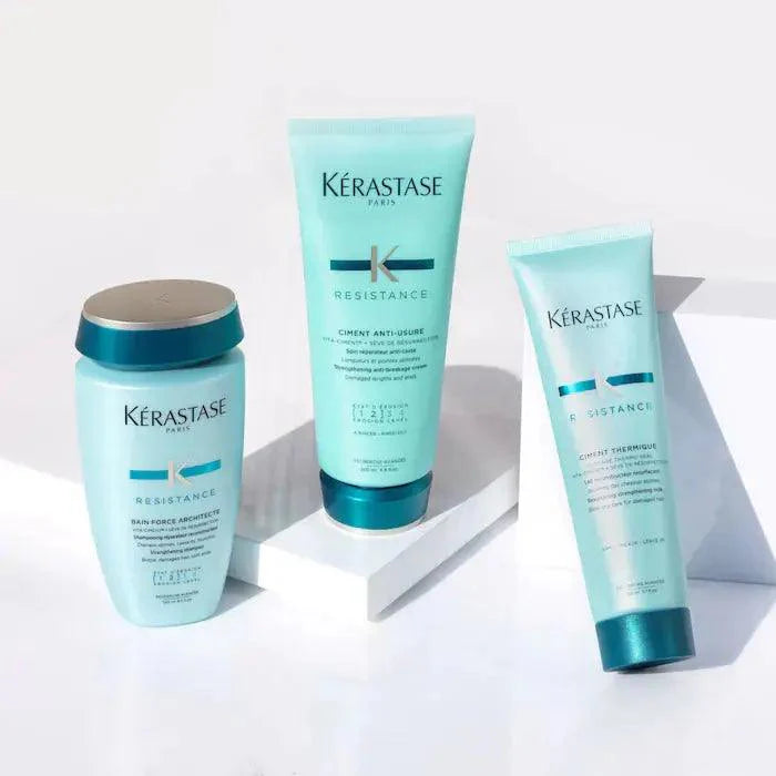 Kérastase Resistance hair care products for damaged hair, including shampoo, conditioner, and serum on white background.