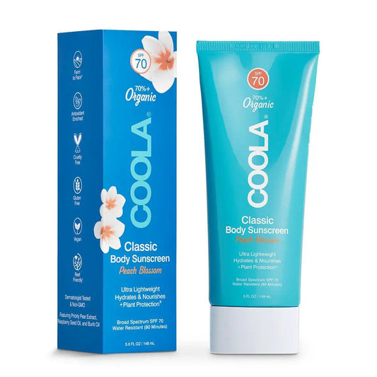 Classic Body Sunscreen Peach Blossom 148ml by Coola, featuring organic protection and lightweight hydration for sun safety.