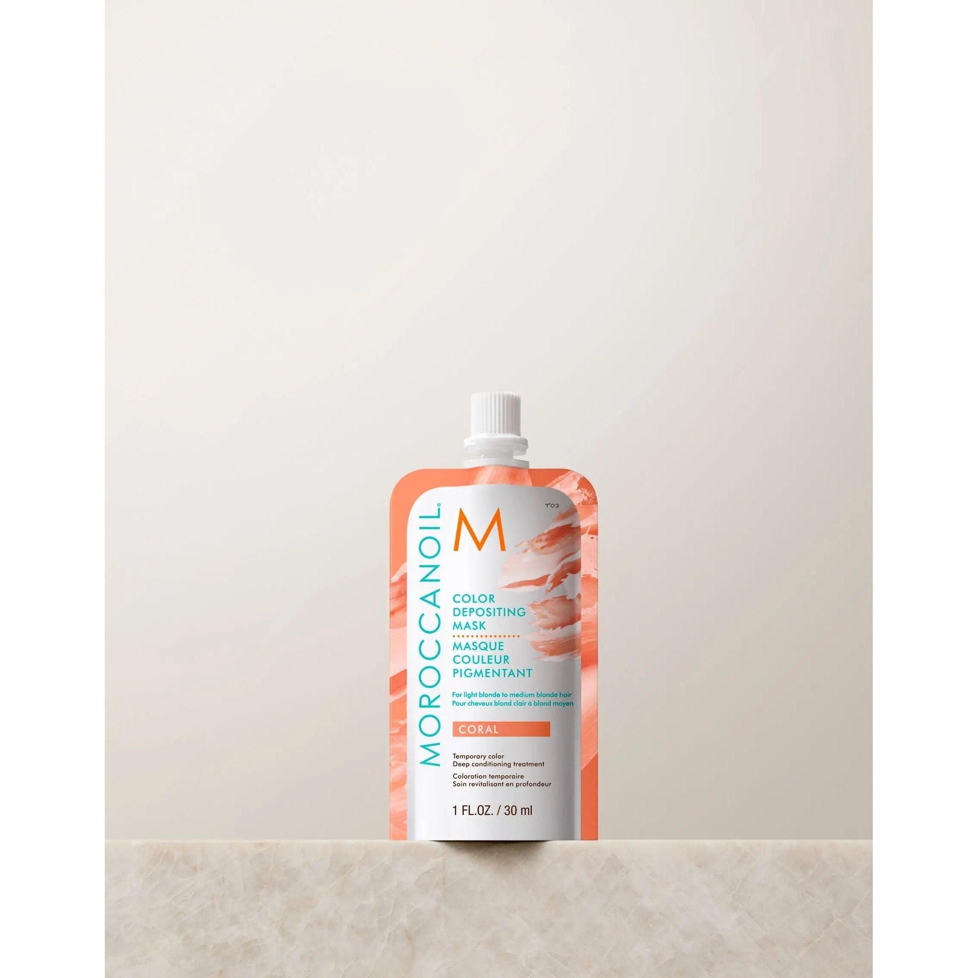 Moroccanoil Color Depositing Mask 30ml in Coral packaging, designed to enhance hair color and shine with argan oil.