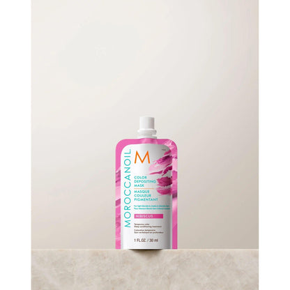 Moroccanoil Color Depositing Mask 30ml in hibiscus, perfect for rejuvenating hair color and adding shine.