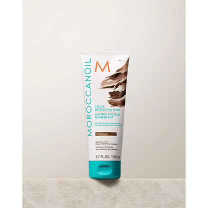 Moroccanoil Color Depositing Mask in Cocoa, 6.7 fl oz, revitalizes hair color and enhances shine.