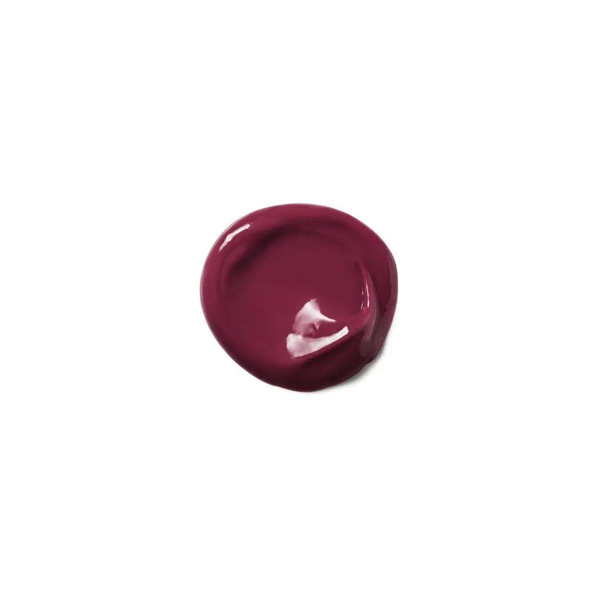 Moroccanoil Color Depositing Mask in rich burgundy shade, ideal for refreshing hair color and enhancing shine.