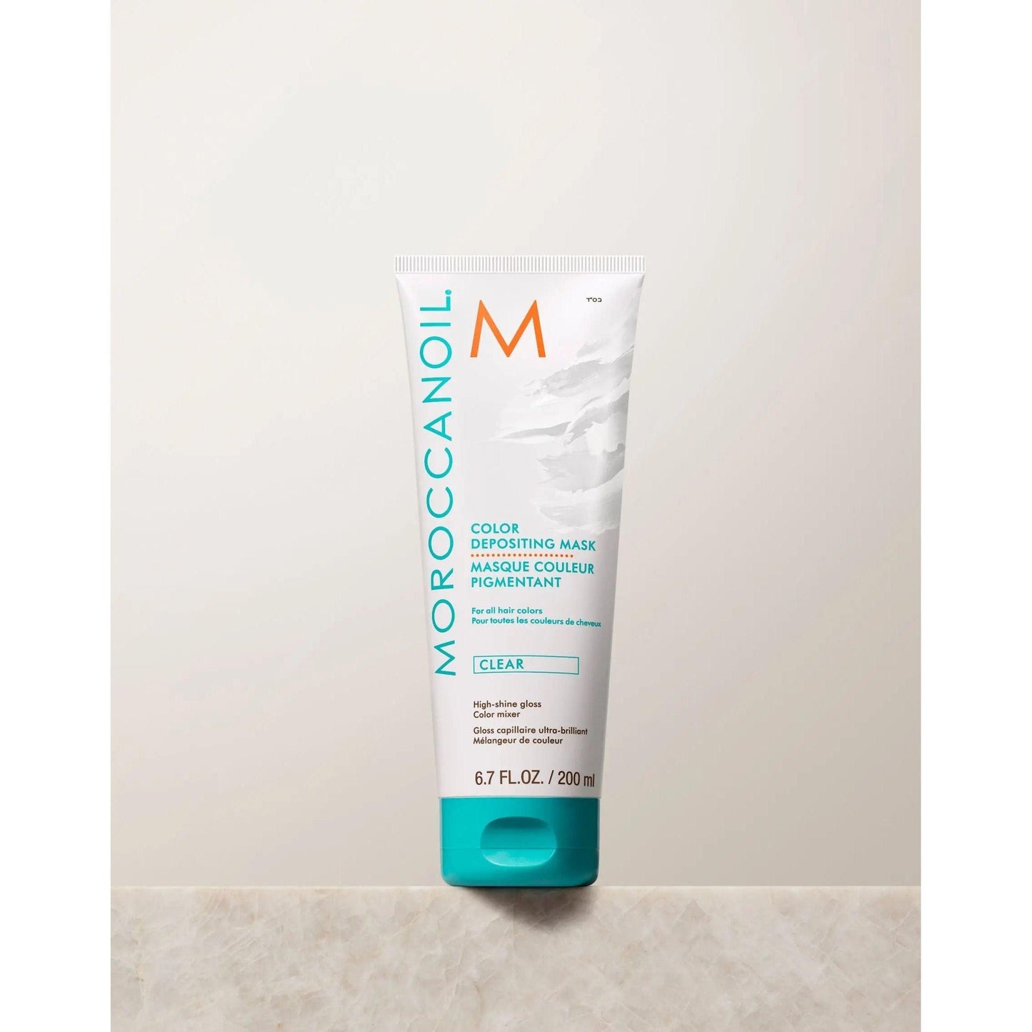 Moroccanoil Color Depositing Mask in clear, 200 ml tube for rejuvenating hair color and deep conditioning.