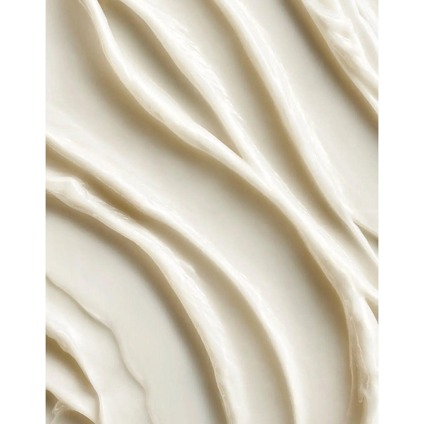 Close-up of a creamy texture from Moroccanoil Color Depositing Mask, showcasing its smooth and rich formulation.