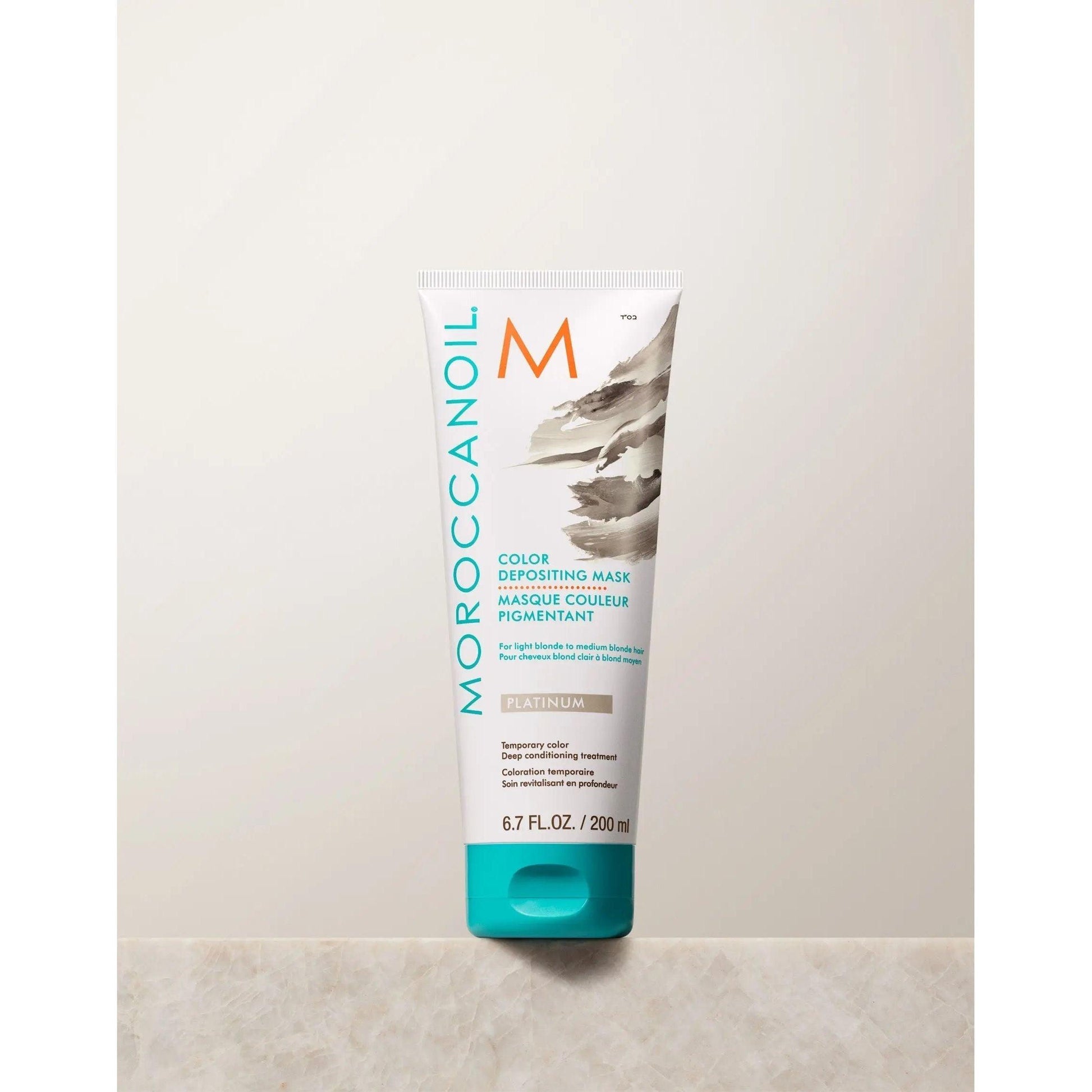 Moroccanoil Color Depositing Mask in platinum, 200 ml tube for rejuvenating and deep conditioning hair color.