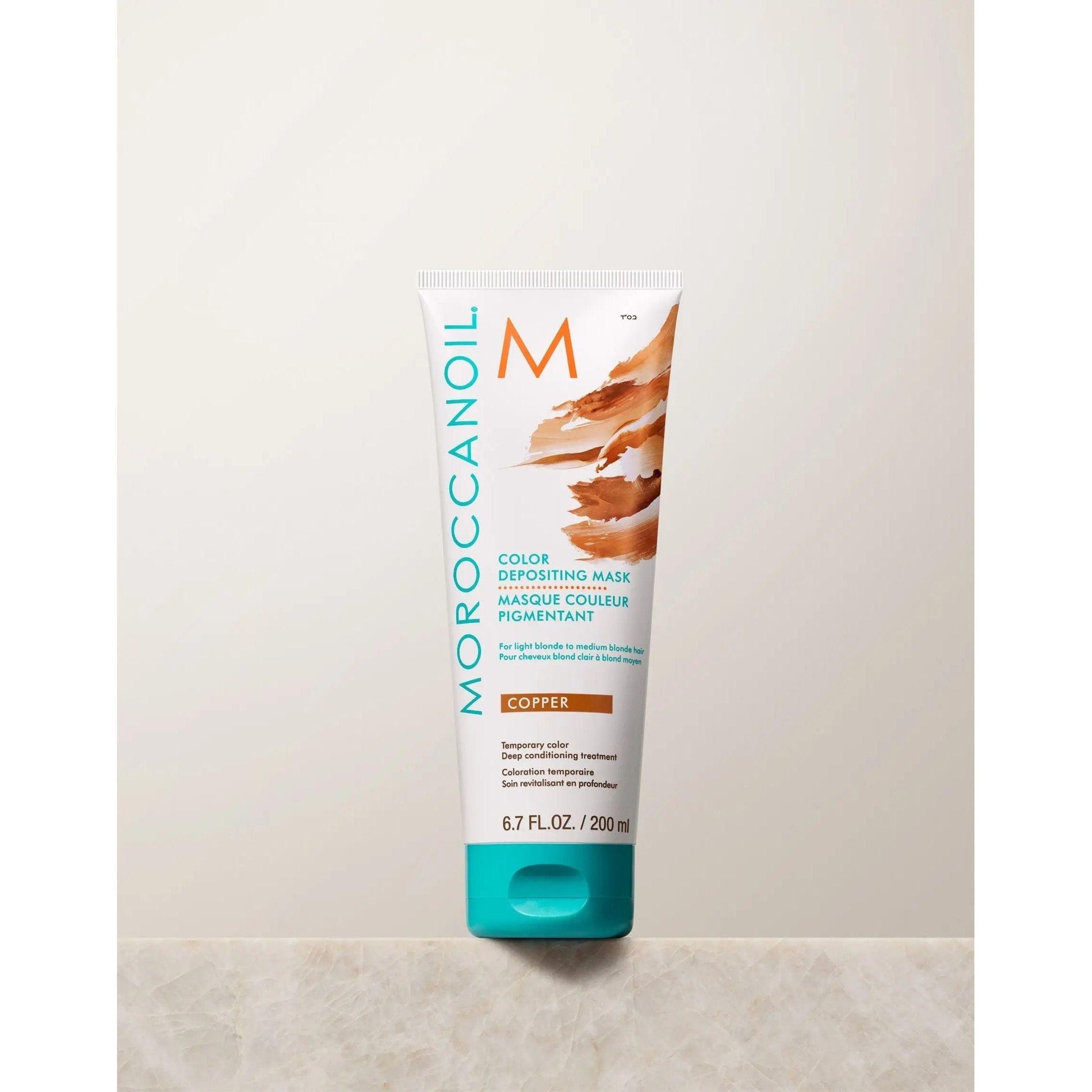 Moroccanoil Color Depositing Mask in Copper, 200ml tube for enhancing and rejuvenating hair color.